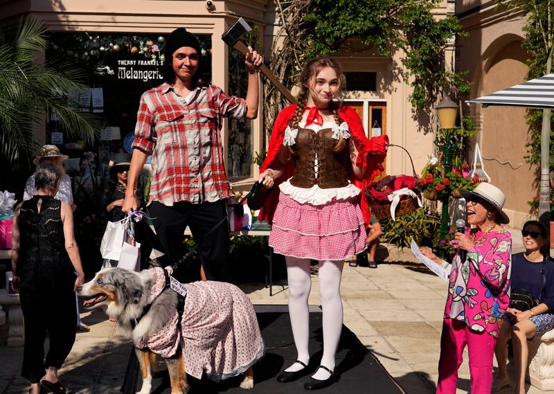 Dorian and Kiana Esparza and their dog Reef won most unique in the large dog category during the 33rd Annual Pet Parade and Costume Contest on March 14 in Via Amore.