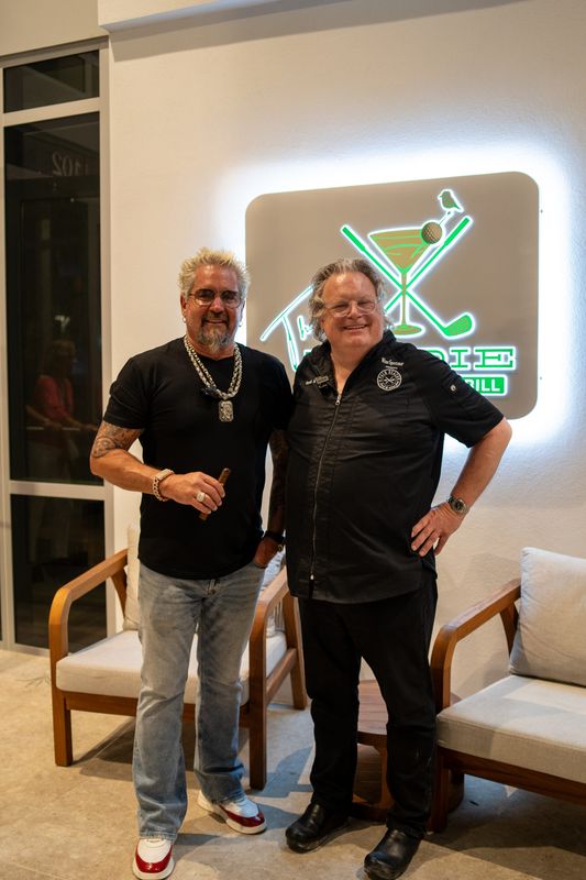 Celeb chefs x 2: Guy Fieri helping chef-owner David Burke celebrate the opening of Birdie, the new elevated sports bar in Lake Park.