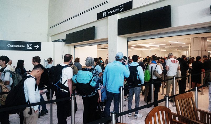 People fill Southwest Florida International Airport on Friday, March 13, 2026. March is typically one of the busiest months of the year for air travel.