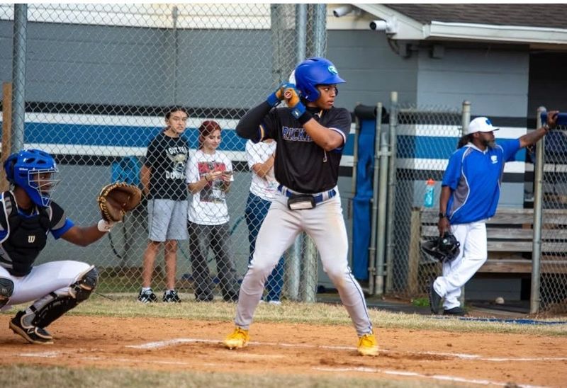 Rickards' Carlos Rolle is at the plate as he waits for the first pitch.