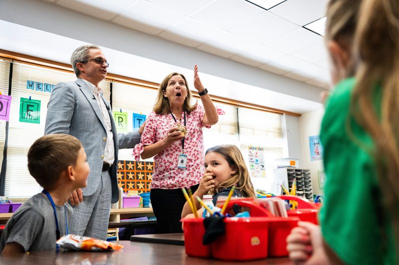 Connie Kinstler reacts after being presented the Golden Apple award by Champions for Learning at Big Cypress Elementary School in Naples, Fla., on Monday, March 16, 2026.