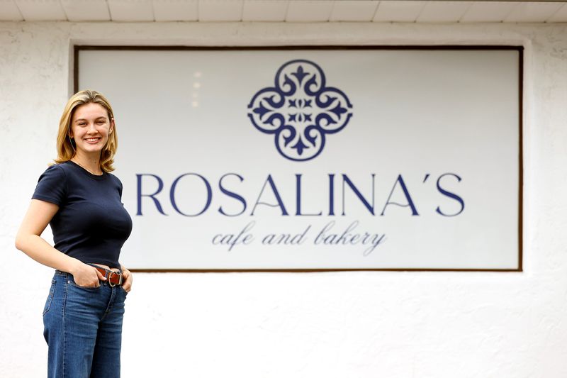 Co-owner Rosalina Ribeiro stands in front of Rosalina's Cafe and Bakery on March 17, 2026, at 820 SE Lincoln Ave. in Stuart.