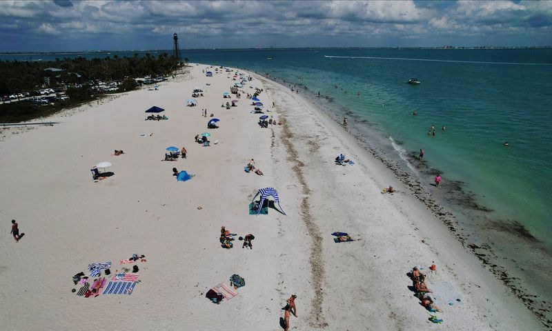Visitors to S.W. Florida took advantage of the beautiful weather Friday, March 13, 2026, as they flocked to Lighthouse Beach on Sanibel.