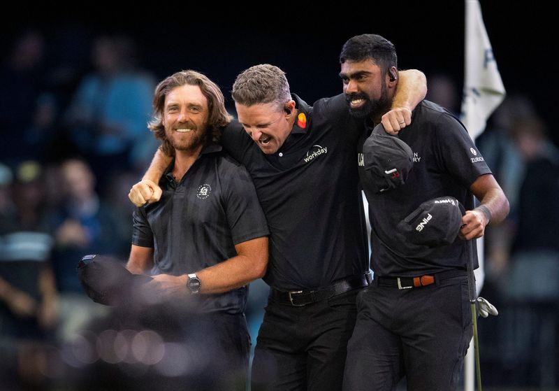 Tommy Fleetwood, left, Justin Rose and
Sahith Theegala, far right, of 
Los Angeles Golf Club celebrate their win over Atlanta Drive GC during TGL match at SoFi Center on March 17, 2026, in Palm Beach Gardens, Florida.