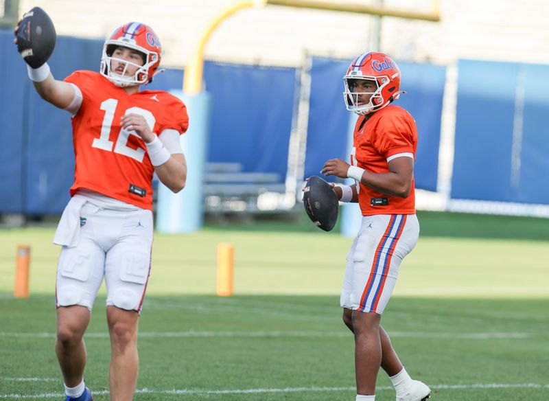 Florida quarterback Aaron Philo (12) throws with Florida quarterback Tramell Jones Jr. (9) during spring practice at Sanders Practice Fields in Gainesville, FL on Thursday, March 12, 2026. [Alan Youngblood/Gainesville Sun]