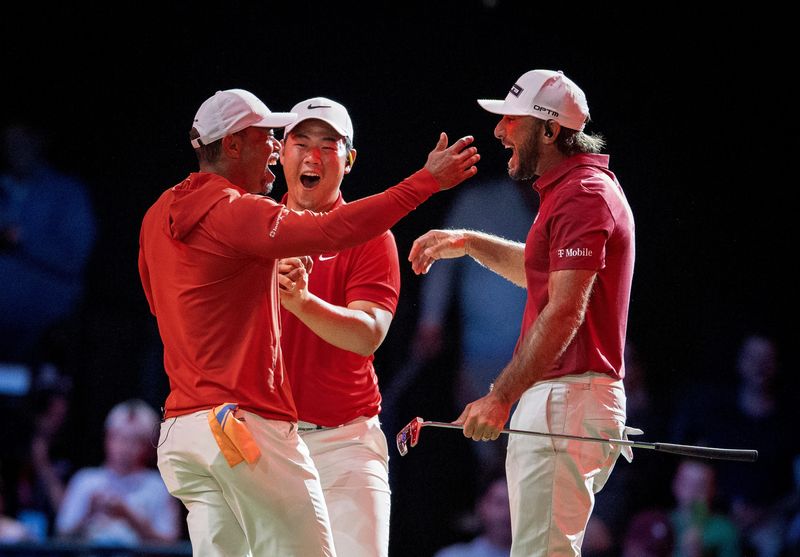 Tiger Woods, Tom Kim and Max Homa of Jupiter Links GC celebrate their win over Boston Common Golf during TGL match at SoFi Center on March 17, 2026, in Palm Beach Gardens, Florida.