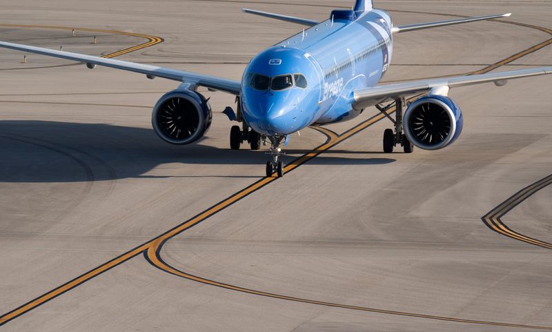 A Breeze Airways jet taxis to the gate at Palm Beach International Airport on March 11, 2026, in West Palm Beach, Florida.