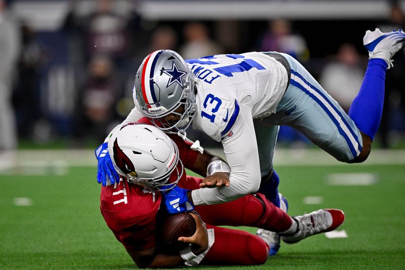 Nov 3, 2025; Arlington, Texas, USA; Dallas Cowboys defensive end Dante Fowler Jr. (13) sacks Arizona Cardinals quarterback Jacoby Brissett (7) during the game between the Dallas Cowboys and the Arizona Cardinals at AT&T Stadium. Mandatory Credit: Jerome Miron-Imagn Images
