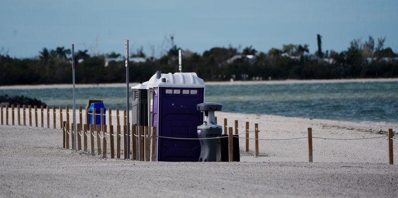 Portable toilets on the Sanibel Causeway March 18, 2026, the same month Lee County commissioners agreed to spend more than $300,000 to elevate restrooms as federal regulations require.