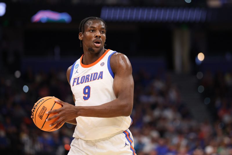 Mar 20, 2026; Tampa, FL, USA; Florida Gators center Rueben Chinyelu (9) looks to pass during the first half against the Prairie View A&M Panthers during a first round game of the men's 2026 NCAA Tournament at Benchmark International Arena. Mandatory Credit: Nathan Ray Seebeck-Imagn Images