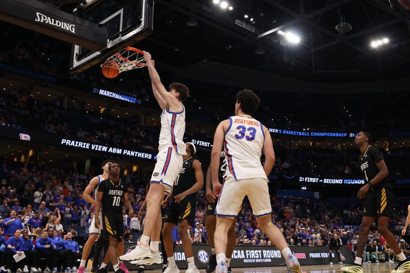Mar 20, 2026; Tampa, FL, USA; Florida Gators center Olivier Rioux (32) dunks the ball in the second half against the Prairie View A&M Panthers during a first round game of the men's 2026 NCAA Tournament at Benchmark International Arena. Mandatory Credit: Matt Pendleton-Imagn Images