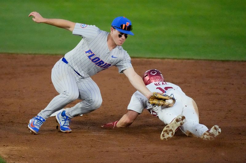 March 20, 2026; Tuscaloosa, AL, USA; Florida second baseman Cade Kurland (4) tags out Alabama base runner Brady Neal (10) as Neal tried to steal second at Sewell-Thomas Stadium for the SEC home opener against Florida.