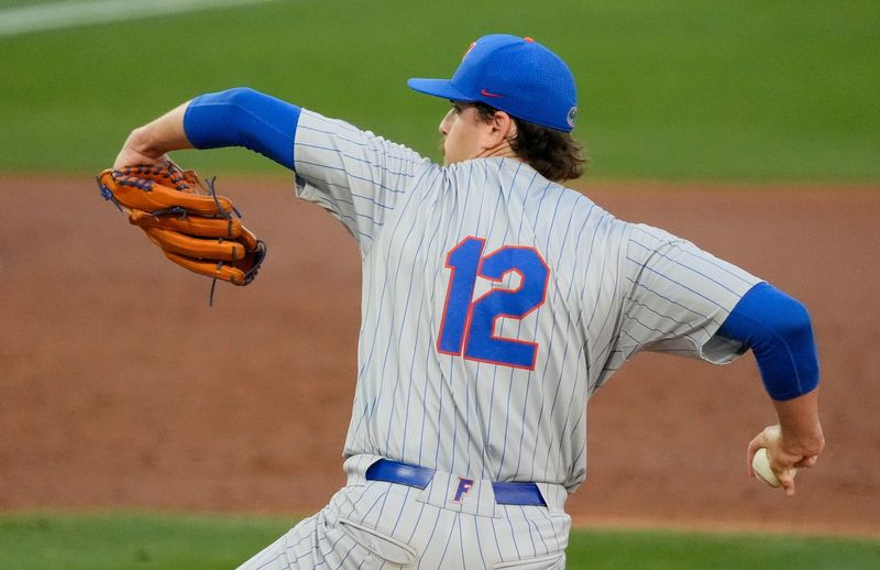 March 20, 2026; Tuscaloosa, AL, USA; Floirda pitcher Liam Peterson (12) makes a pitch at Sewell-Thomas Stadium for the SEC home opener against Alabama.