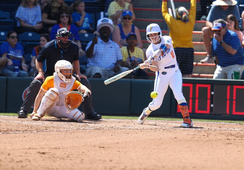 Florida infielder Kendall Grover (12) hits against Tennesse during a NCAA softball game at Katie Seashole Pressly Stadium in Gainesville, FL on Saturday, March 21, 2026. Florida won 5-2[Alan Youngblood/Gainesville Sun]