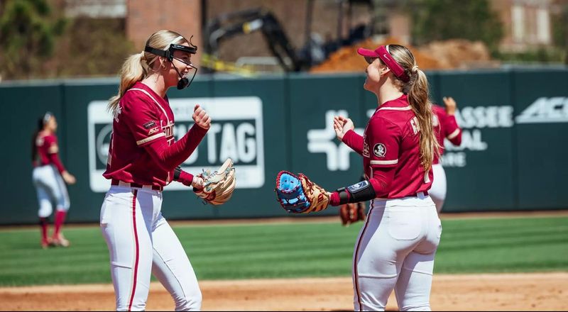 Bella Dimitrijevic (left) and Hayley Griggs (right) celebrate during Florida State softball's victory over Cal.