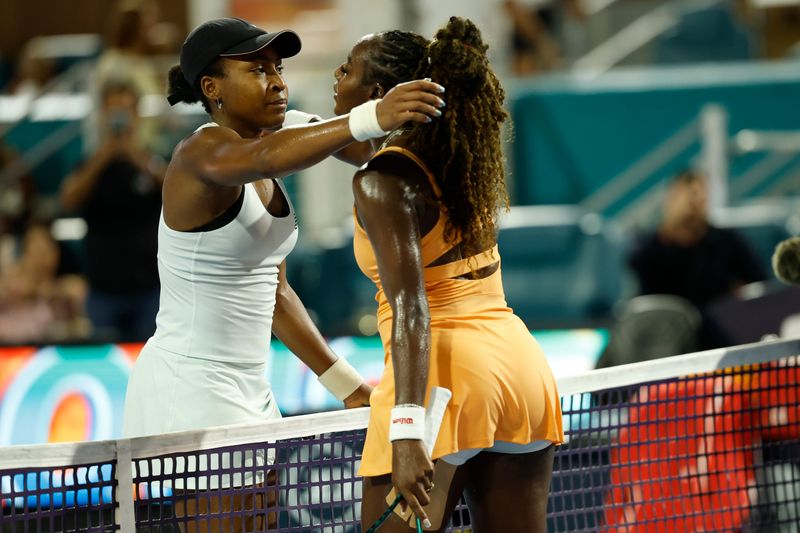 Mar 21, 2026; Miami Gardens, FL, USA; Coco Gauff (USA) (L) hugs Alycia Parks (USA) (R) at the net after their match on day five of the 2026 Miami Open at Hard Rock Stadium. Mandatory Credit: Geoff Burke-Imagn Images