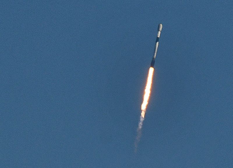 Crowds on the beach in Cocoa Beach watch the launch of the SpaceX Falcon 9 rocket carrying 29 Starlink satellites. The rocket launched at 10:47 a.m. EST on Sunday, March 22 from Launch Complex 40 at Cape Canaveral Space Force Station.