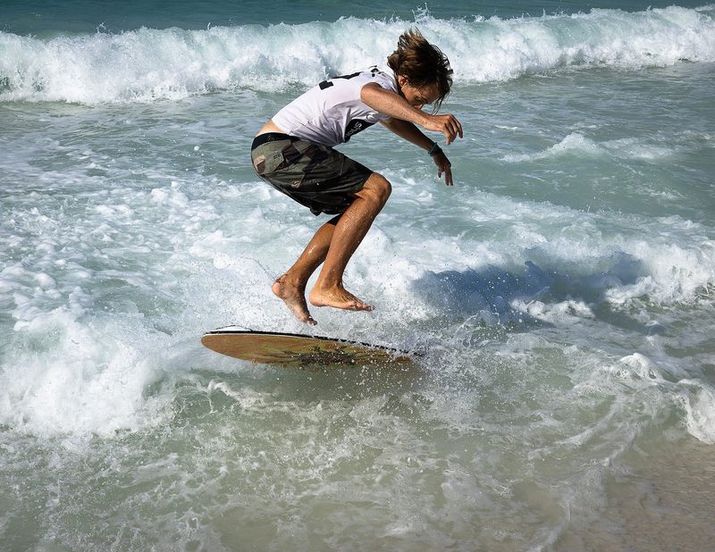 Skimboarder near Richard Seltzer Park in Panama City Beach, Florida, March 22, 2026. The event, PCB Spring Break Skim Jam 2026, was sponsored by Mr. Surf's Surf Shop, and shore lb., aka shore pound. (Tyler Orsburn/Panama City News Herald)