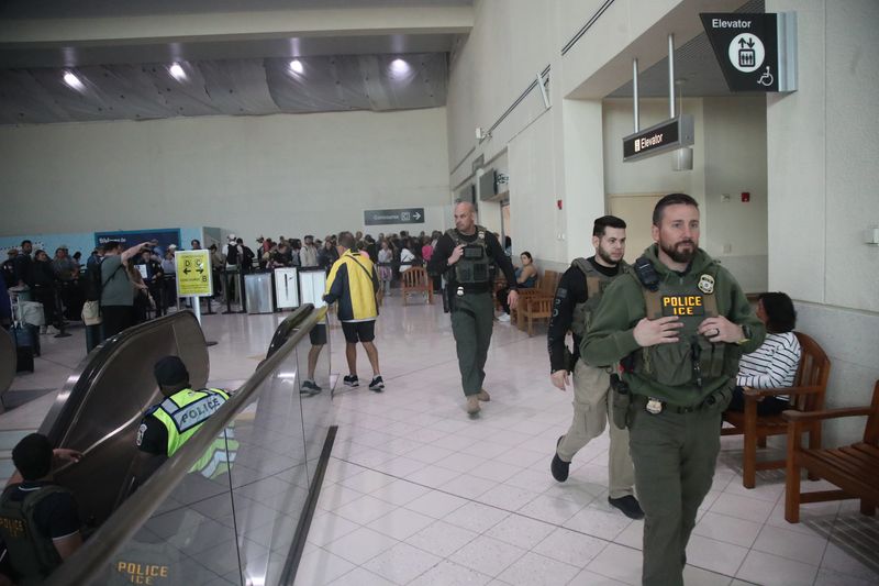 Members of Immigration and Customs Enforcement are seen at Southwest Florida International Airport onMonday, March 23, 2026. They are helping with TSA staff shortages.