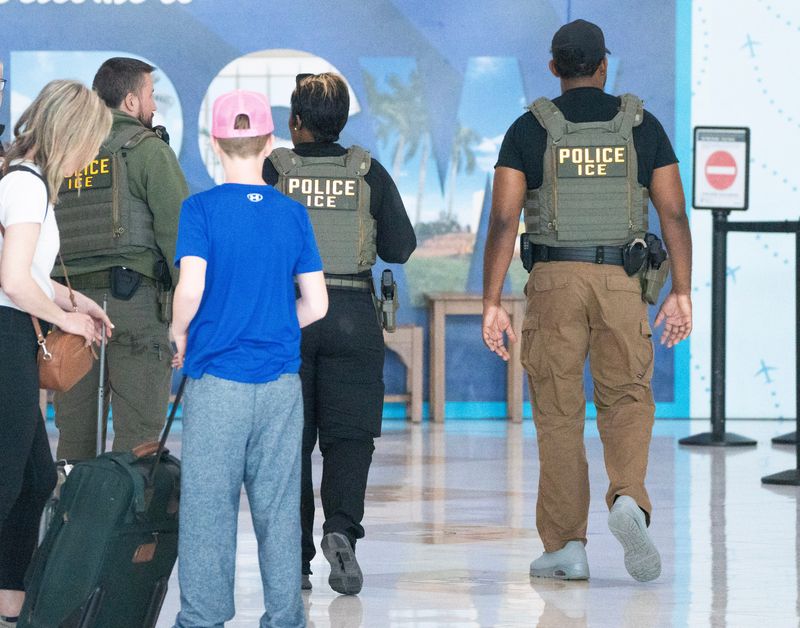 Members of Immigration and Customs Enforcement are seen at Southwest Florida International Airport onMonday, March 23, 2026. They are helping with TSA staff shortages.