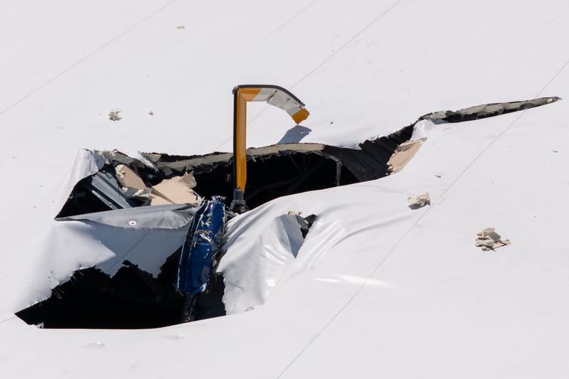 A helicopter crashed into a warehouse roof at Egret Point Logistics Center on South Congress Avenue in Boynton Beach, Fla., on March 23, 2026.