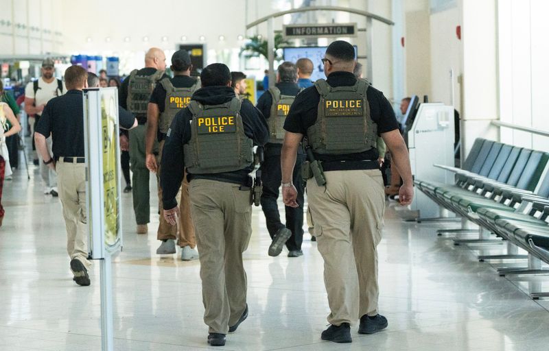 Members of Immigration and Customs Enforcement are seen at Southwest Florida International Airport on Monday, March 23, 2026. They are helping with TSA staff shortages.