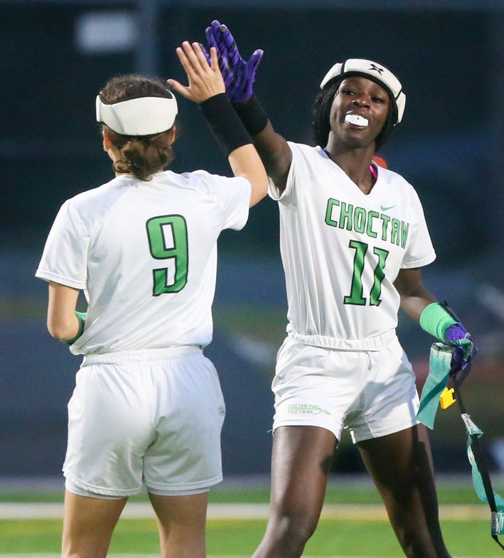 Choctaw’s Tishelle Bowles (11) is high fived by QB Diaris Morales after scoring a touchdown during the Niceville Choctaw flag football game at Niceville.