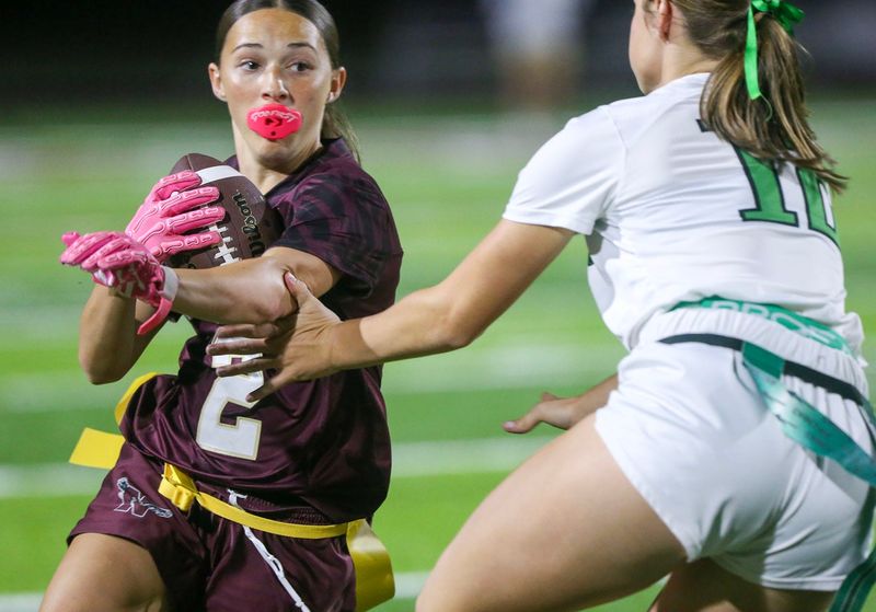 Niceville’s Jori Brechler evades a tackle en route to a touchdown run during the Niceville Choctaw flag football game at Niceville.