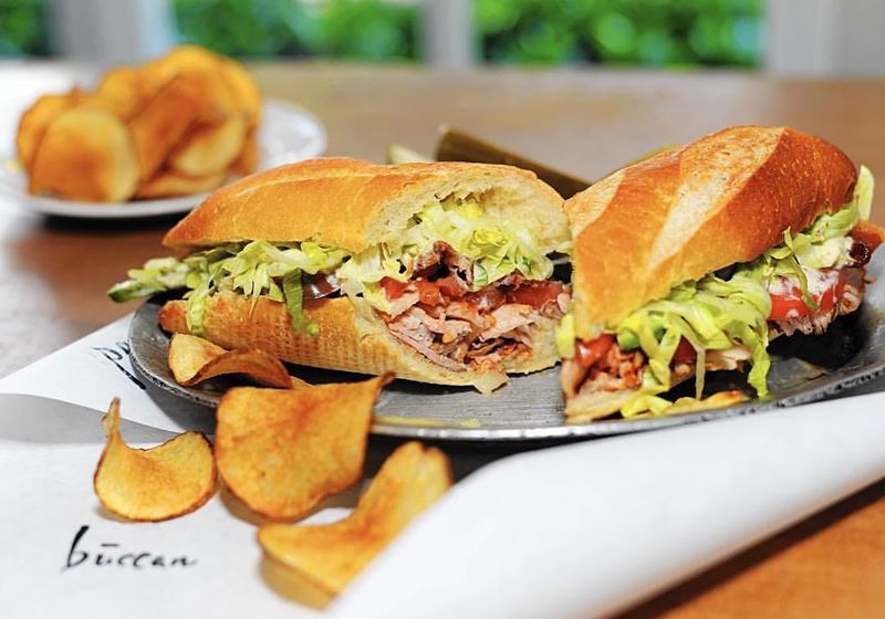 A sandwich with chips at Buccan Sandwich Shop.