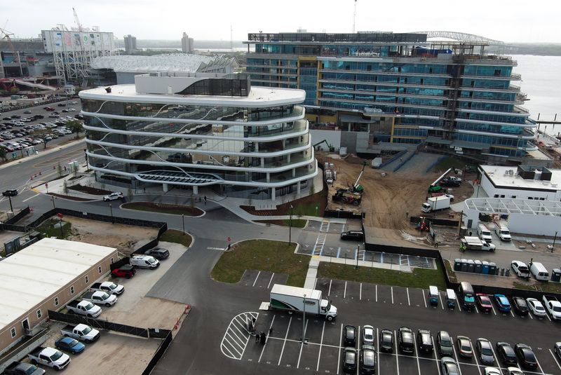 The Jacksonville Jaguars opened their business operations office at One Tower Court, Wednesday March 25, 2026, left. The Jaguars' 75,287-square-foot business operations occupy the building's second through fourth floors. The Four Seasons Hotel, right, is still under construction. [Doug Engle/Florida Times-Union]