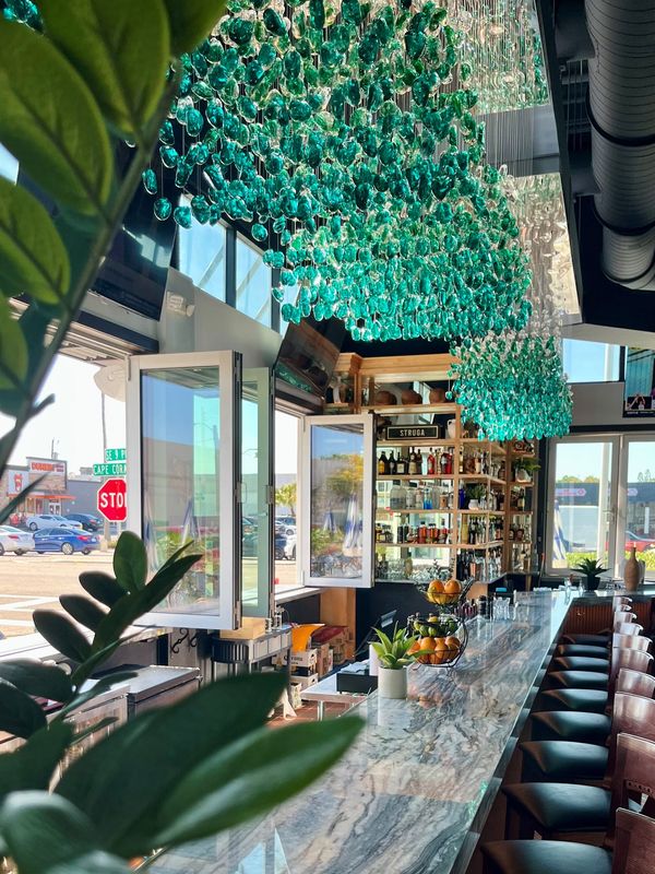 Gorgeous glass chandeliers are a trademark of Aqua.