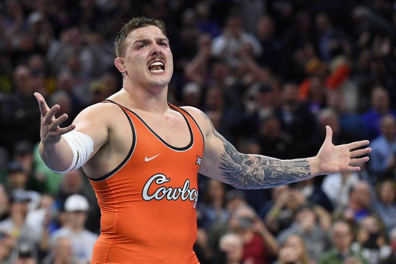 Mar 22, 2025; Philadelphia, PA, USA; Wyatt Hendrickson of the Oklahoma State Cowboys reacts after defeating Gable Steveson of the Minnesota Golden Gophers (not pictured) during the Division I Men's Wrestling Championship held at Wells Fargo Center. Mandatory Credit: Eric Hartline-Imagn Images