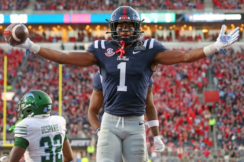 Dec 20, 2025; Oxford, MS, USA; Mississippi Rebels wide receiver De'Zhaun Stribling (1) reacts after a catch for a touchdown during the third quarter against the Tulane Green Wave at Vaught-Hemingway Stadium. Mandatory Credit: Petre Thomas-Imagn Images