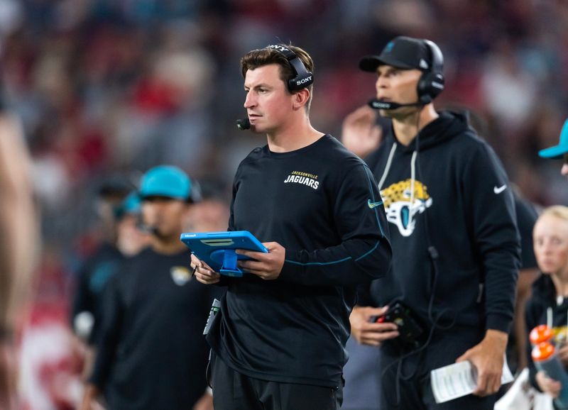 Nov 23, 2025; Glendale, Arizona, USA; Jacksonville Jaguars offensive coordinator Grant Udinski against the Arizona Cardinals at State Farm Stadium. Mandatory Credit: Mark J. Rebilas-Imagn Images