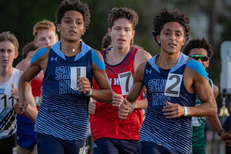Spanish River Community High School's Preston Sangely (4:27.55) left, and his brother Casey Sangely (4:27.77) placed first and second in the boys 1600-meter race at the Palm Beach County Track and Field Championships at Lincoln Knowles Track on William T. Dwyer High School's campus in Palm Beach Gardens, Fla., on March 31, 2026.