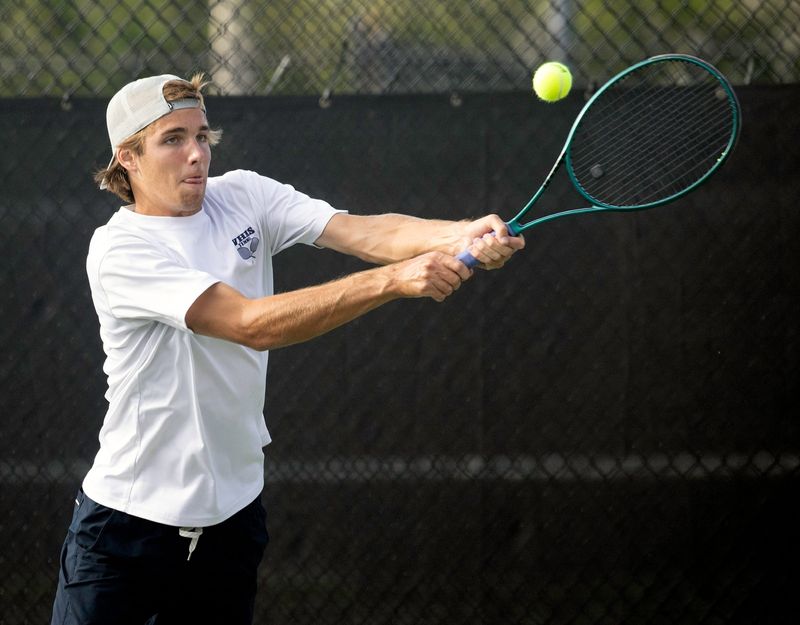 Winter Haven's Everett Whitehead hits a backhand during the No. 1 doubles final on Wednesday in the Polk County Boys Tennis Tournament at the Dave Beerman Family Tennis Center. Earlier in the day, he won the No. 1 singles final.