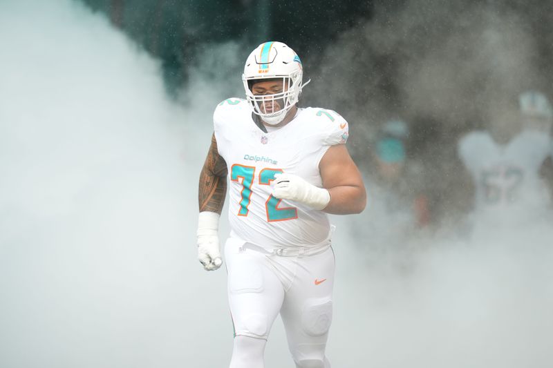 Nov 30, 2025; Miami Gardens, Florida, USA; Miami Dolphins guard Jonah Savaiinaea (72) takes the field prior to a game against the New Orleans Saints at Hard Rock Stadium. Mandatory Credit: Rich Storry-Imagn Images