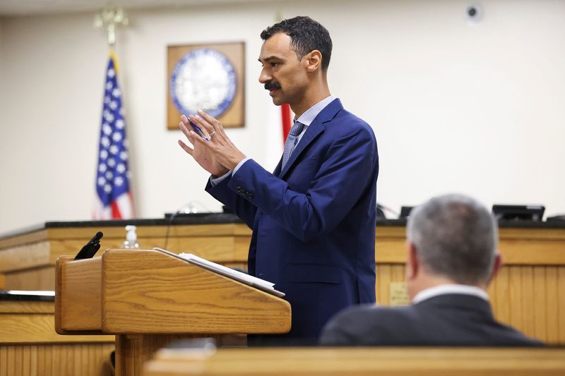 Matt Theobald's attorney Martin Powell questions a witness during Theobald's administrative hearing in Administrative Law Judge Jodi-Ann Livingstone's courtroom, April 2, 2026, at the Martin County Courthouse in Stuart. The hearing will determine the fate of Theobald's employment with the Martin County School District following his social media post last year about the death of conservative activist Charlie Kirk. Theobald was a teacher at Spectrum Academy in Stuart and president of the district's teachers union, the Martin County Education Association, when he allegedly posted that Kirk was a "racist, misogynistic, fear-mongering, xenophobic neo-Nazi."