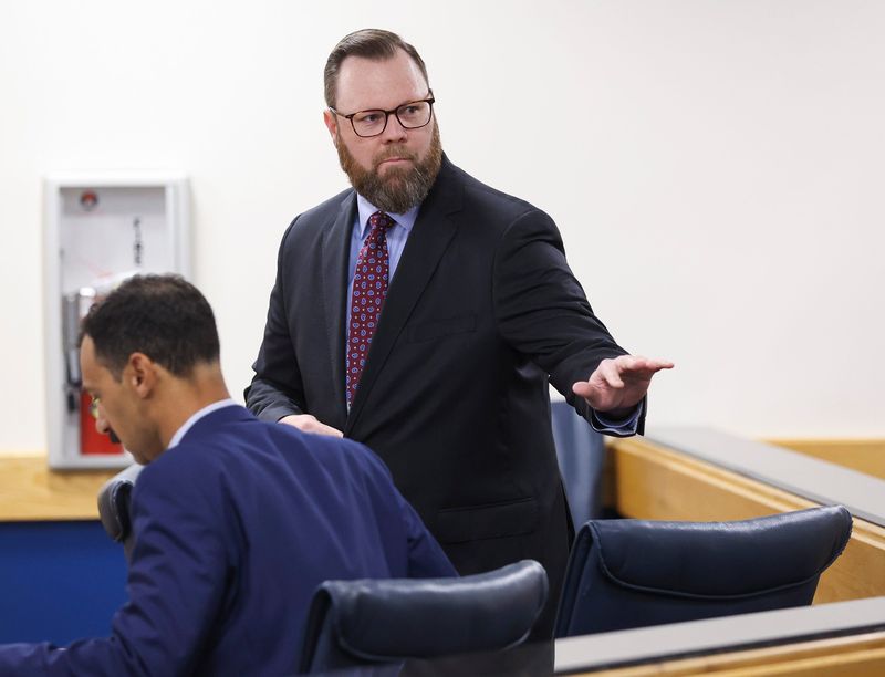 Matt Theobald's, right, administrative hearing is held in Administrative Law Judge Jodi-Ann Livingstone's courtroom, April 2, 2026, at the Martin County Courthouse in Stuart. The hearing will determine the fate of Theobald's employment with the Martin County School District following his social media post last year about the death of conservative activist Charlie Kirk. Theobald was a teacher at Spectrum Academy in Stuart and president of the district's teachers union, the Martin County Education Association, when he allegedly posted that Kirk was a "racist, misogynistic, fear-mongering, xenophobic neo-Nazi."