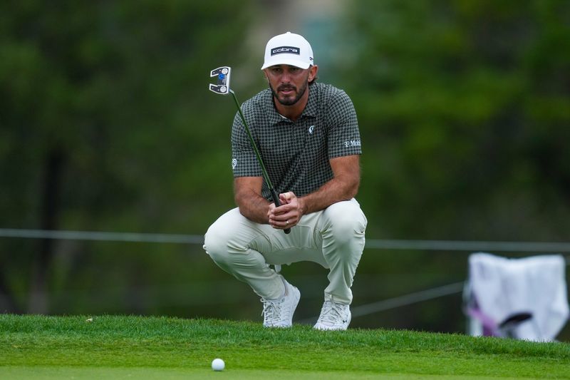 Apr 2, 2026; San Antonio, Texas, USA; Max Homa lines up a putt on the 11th green during the first round of the Valero Texas Open golf tournament. Mandatory Credit: Daniel Dunn-Imagn Images