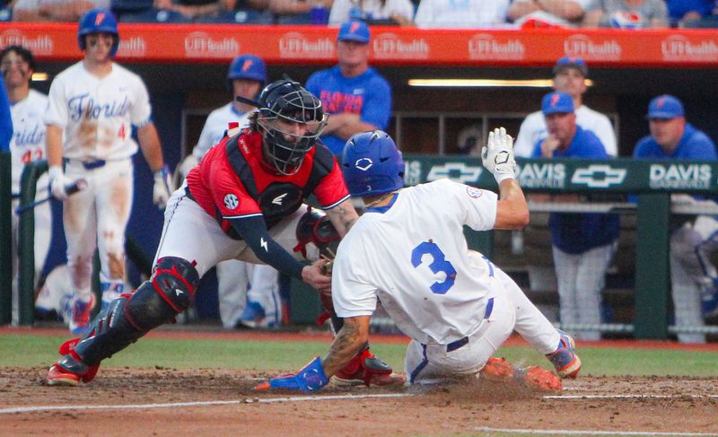 Florida baseball's Kyle Jones gets tagged out at home plate by Ole Miss catcher Austin Fawley at Condron Ballpark on Thursday, April 2.