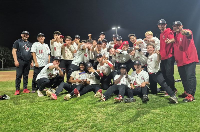 Baldwin players and coaches celebrate after defeating Sandalwood 4-3 for the Gateway Conference high school baseball championship on April 2, 2026. [Clayton Freeman/Florida Times-Union]