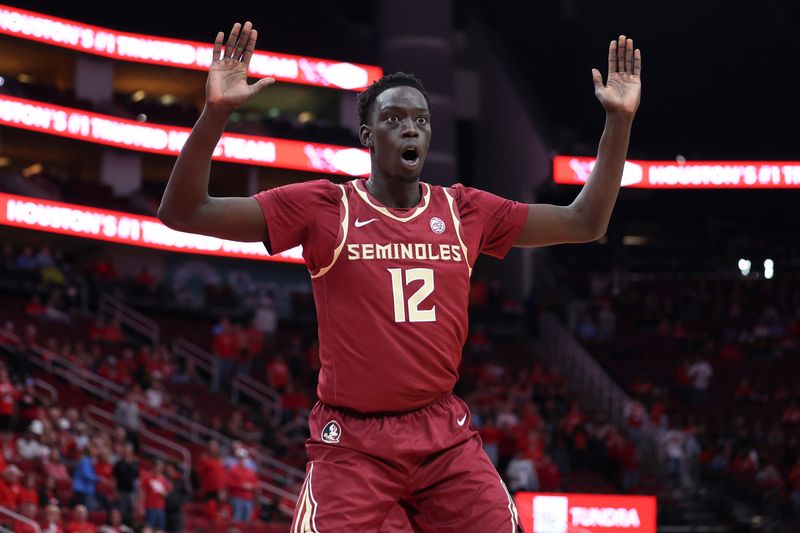 Dec 6, 2025; Houston, TX, USA; Florida State Seminoles forward Alier Maluk (12) reacts after a play during the first half against the Houston Cougars at Toyota Center. Mandatory Credit: Troy Taormina-Imagn Images