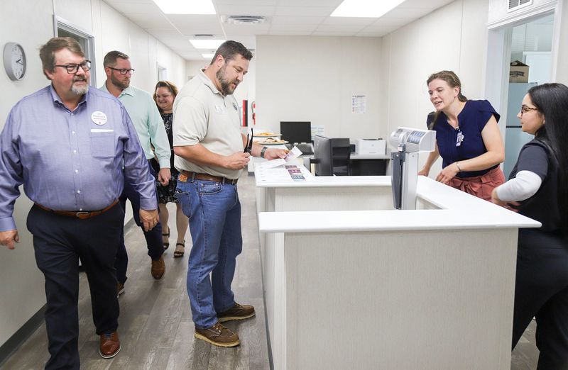 Employees and guests tour the new Okaloosa County School District Employee Health Clinic in Fort Walton Beach on April 2, 2026. The clinic, in partnership with Marathon Health, will be able to provide more affordable healthcare for employees with clinic hours that fit their work schedules and needs.