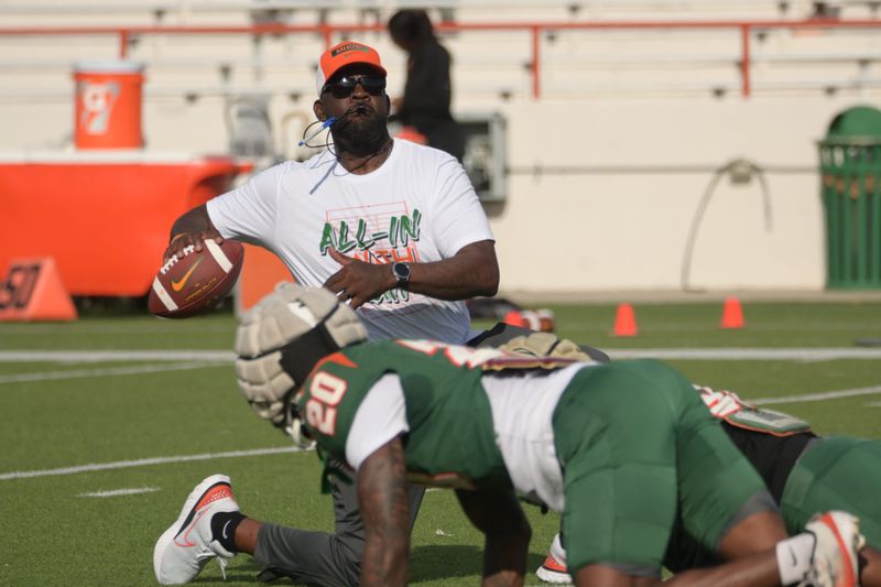 Florida A&M Rattlers head coach Quinn Gray Sr. leads his team during warmups for the 'Friday Night Strike' Orange and Green Spring Football Game on Ken Riley Field at Bragg Memorial Stadium in Tallahassee, Florida, Friday, April 3, 2026.