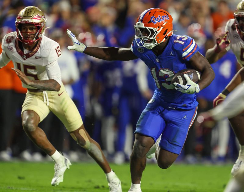 Florida running back Jadan Baugh (13) runs during the second half of an NCAA football game at Steve Spurrier Field at Ben Hill Griffin Stadium in Gainesville, FL on Saturday, November 29, Florida beat Florida State 40-21.2025. [Alan Youngblood/Gainesville Sun]