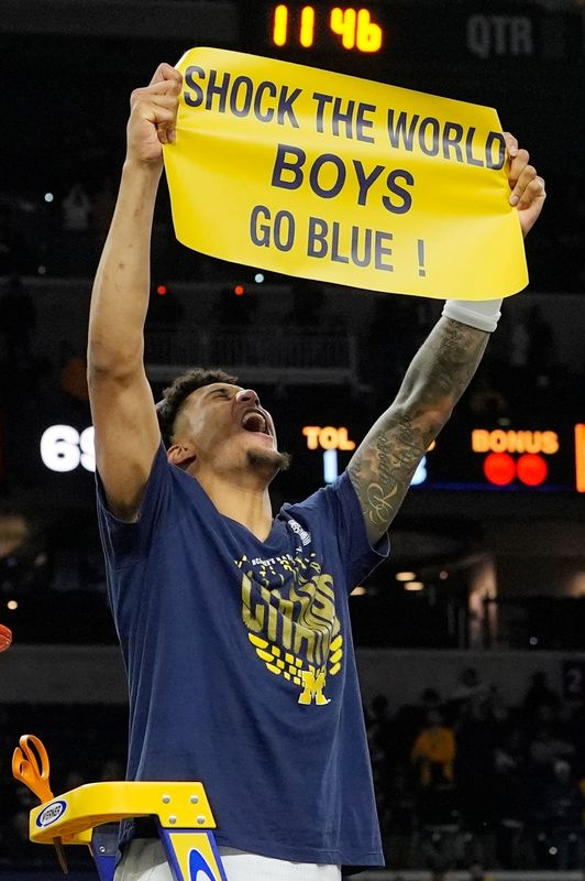 Michigan forward Yaxel Lendeborg (23) celebrates winning the NCAA national championship against Connecticut at Lucas Oil Stadium in Indianapolis on Monday, April 6, 2026.