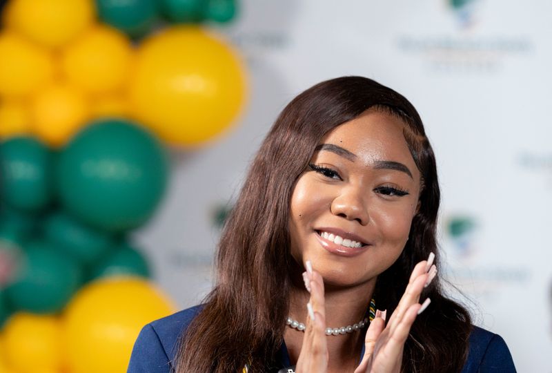 Lexiana-Marie Morlales smiles after she and other Palm Beach Lakes High School seniors received full scholarships to attend Palm Beach State College to earn an Associate degree paid for by the Stephen M. Ross Emerging Scholars Program