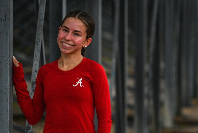 Satellite High runner Celina Coryell just broke the school record in the 1600 meter, the 3200 meter record as well as the Cape Coast Conference record in the 3200. The Satellite High senior was photographed at an early morning workout wearing the crimson University of Alabama shirt.