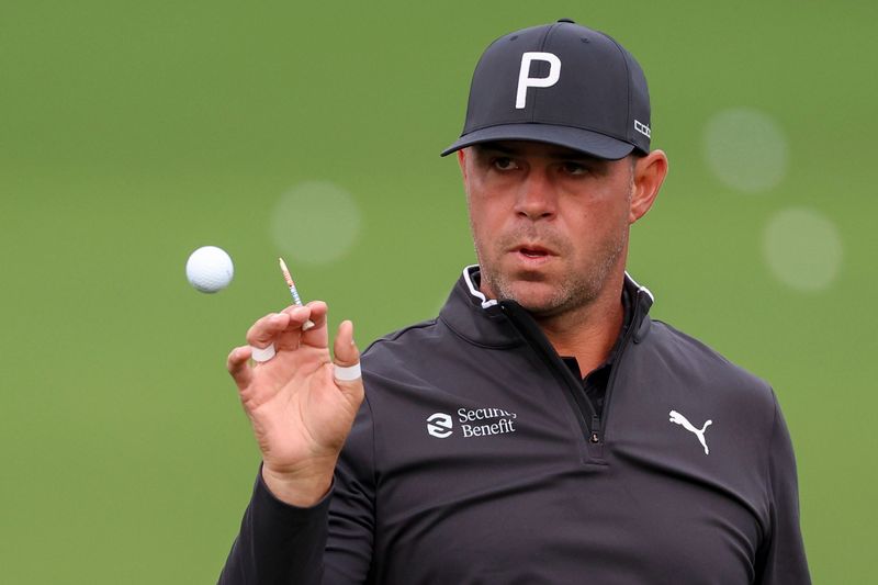 Gary Woodland hits balls at the practice facility during a practice round for the 2026 Masters Tournament at Augusta National Golf Club.